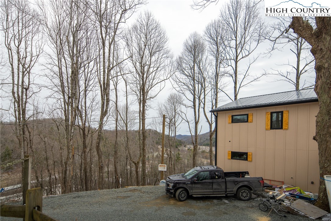 329 Maplewood Circle Boone, NC 28607 - Photo 36 of 46 a car parked in front of a white house