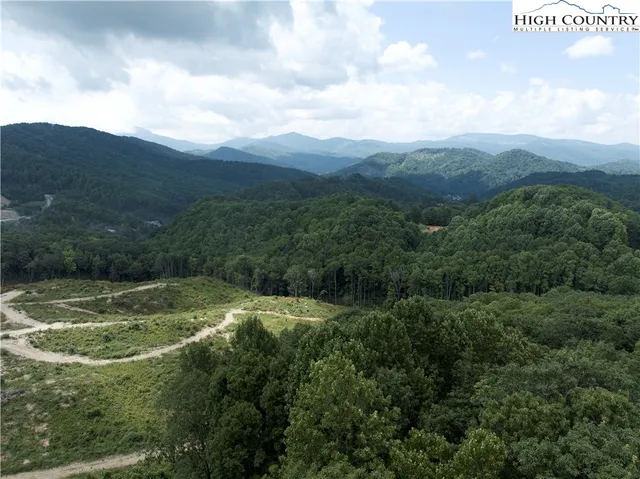 a view of a town with mountains in the background