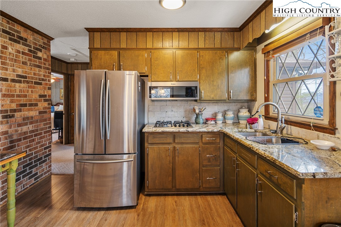 329 Maplewood Circle Boone, NC 28607 - Photo 6 of 46 a kitchen with a refrigerator and a sink