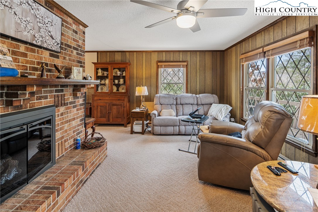 329 Maplewood Circle Boone, NC 28607 - Photo 10 of 46 a living room with furniture and a fireplace