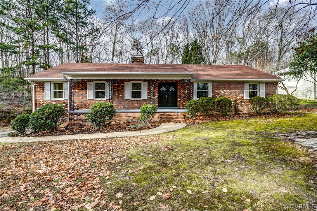 4208 Croatan Road Richmond, VA 23235 - Photo 1 of 50 a front view of a house with garden