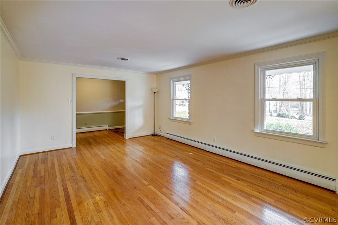 4208 Croatan Road Richmond, VA 23235 - Photo 15 of 50 a view of an empty room with wooden floor and a window