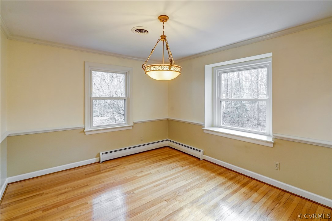 4208 Croatan Road Richmond, VA 23235 - Photo 16 of 50 a view of a room with a window and wooden floor