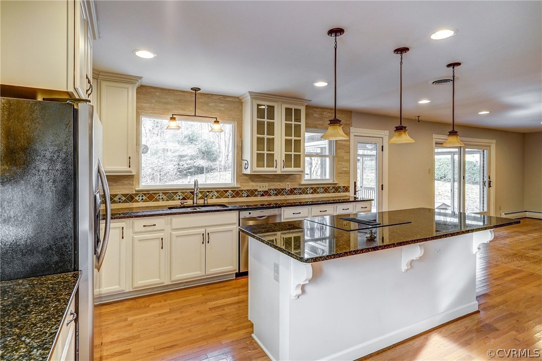 4208 Croatan Road Richmond, VA 23235 - Photo 18 of 50 a kitchen with stainless steel appliances granite countertop a sink a counter space and a window
