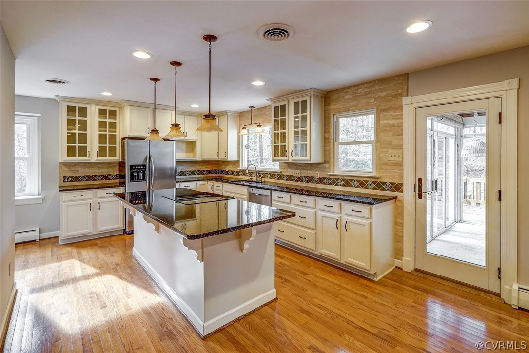 4208 Croatan Road Richmond, VA 23235 - Photo 19 of 50 a kitchen with stainless steel appliances granite countertop a stove a sink and a refrigerator