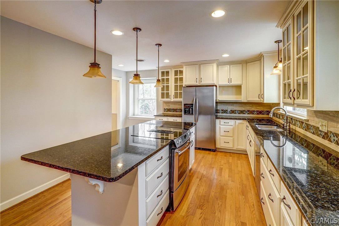 4208 Croatan Road Richmond, VA 23235 - Photo 20 of 50 a kitchen with stainless steel appliances granite countertop a sink a stove and refrigerator