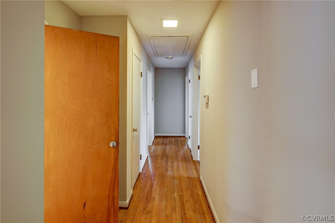 4208 Croatan Road Richmond, VA 23235 - Photo 29 of 50 a view of a hallway with wooden floor