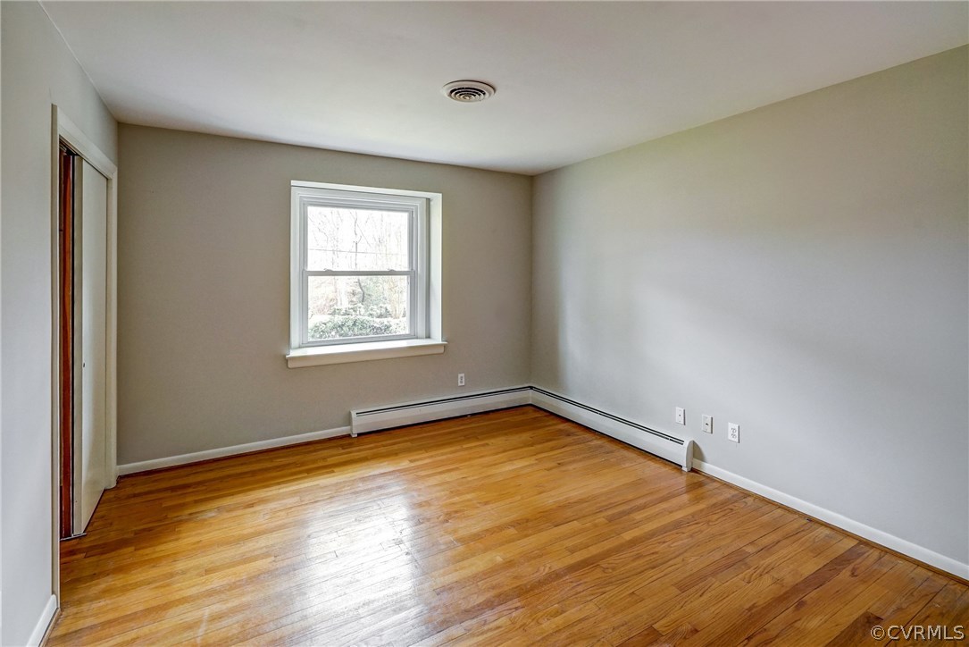4208 Croatan Road Richmond, VA 23235 - Photo 31 of 50 an empty room with wooden floor and windows