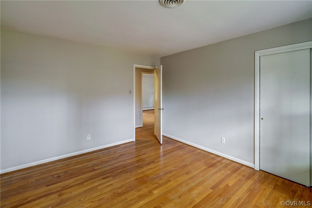 4208 Croatan Road Richmond, VA 23235 - Photo 32 of 50 a view of an empty room with wooden floor