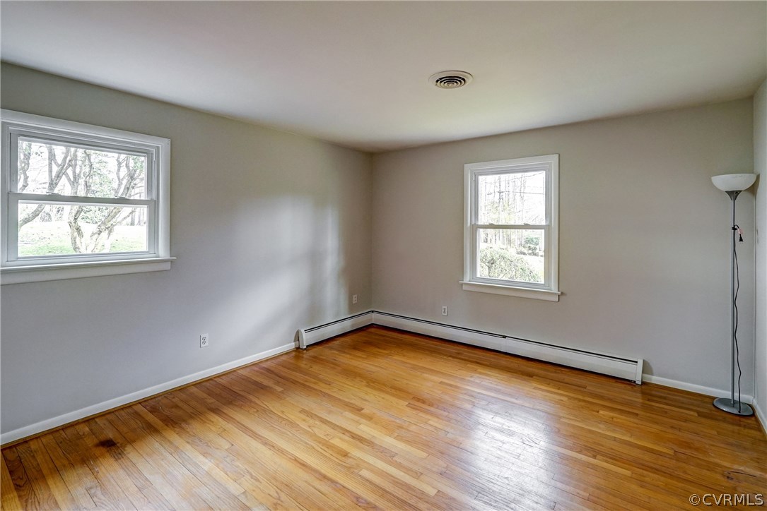 4208 Croatan Road Richmond, VA 23235 - Photo 33 of 50 an empty room with wooden floor and windows