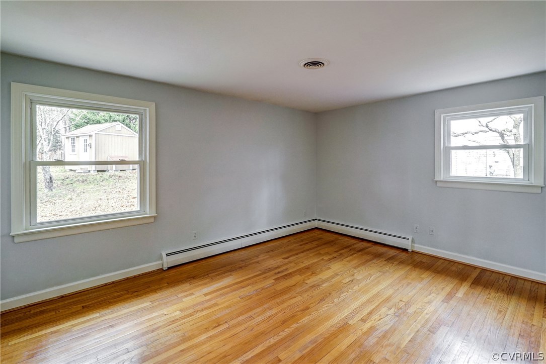 4208 Croatan Road Richmond, VA 23235 - Photo 35 of 50 a view of empty room with wooden floor and fan