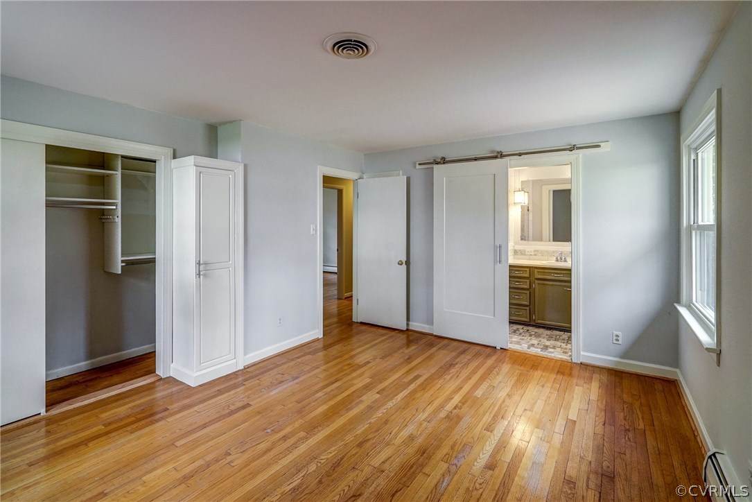 4208 Croatan Road Richmond, VA 23235 - Photo 36 of 50 an empty room with wooden floor and windows