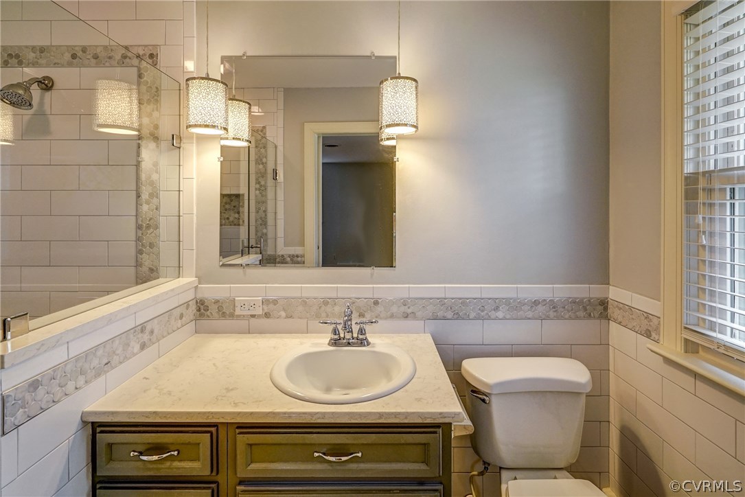 4208 Croatan Road Richmond, VA 23235 - Photo 37 of 50 a bathroom with a sink and a mirror