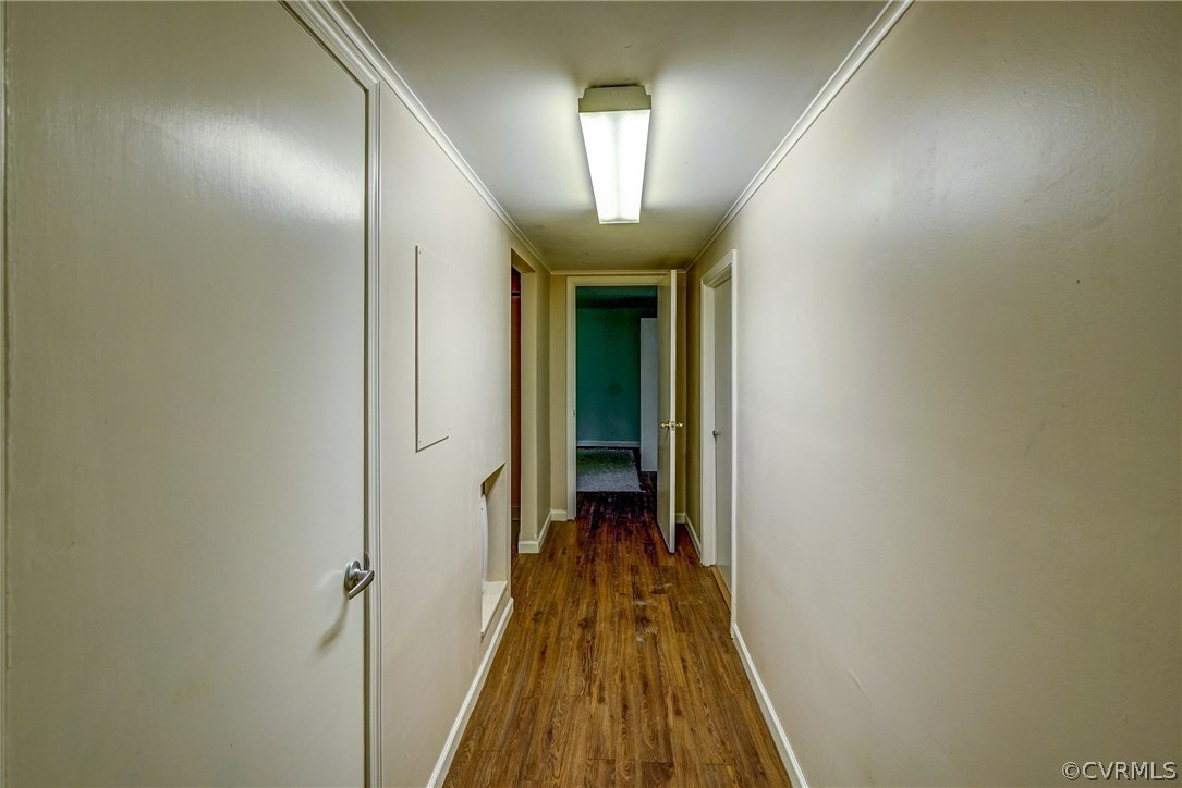4208 Croatan Road Richmond, VA 23235 - Photo 42 of 50 a view of a hallway with wooden floor and a bathroom