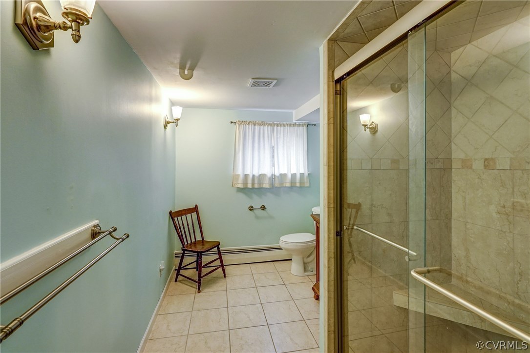 4208 Croatan Road Richmond, VA 23235 - Photo 43 of 50 a bathroom with a toilet and a shower
