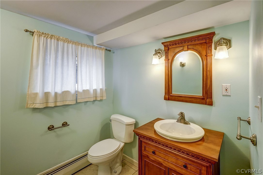 4208 Croatan Road Richmond, VA 23235 - Photo 44 of 50 a bathroom with a granite countertop sink and a mirror
