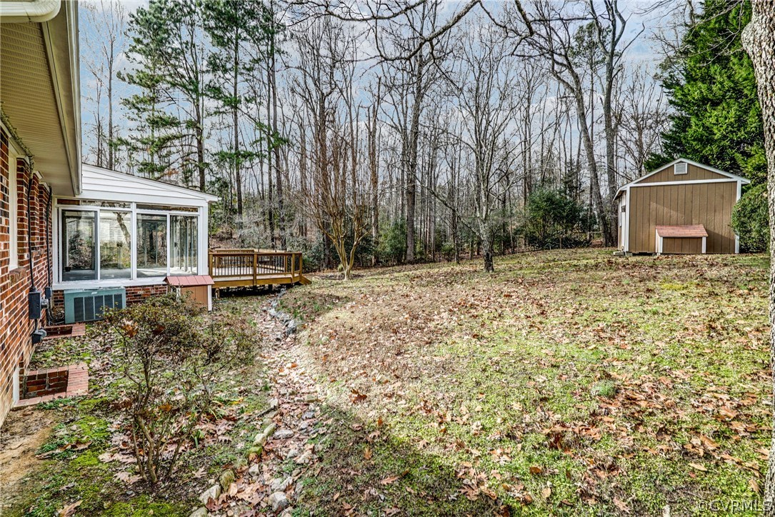 4208 Croatan Road Richmond, VA 23235 - Photo 5 of 50 a house with trees in front of it