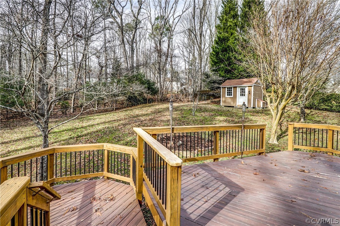 4208 Croatan Road Richmond, VA 23235 - Photo 10 of 50 a view of a roof deck with wooden fence and large trees