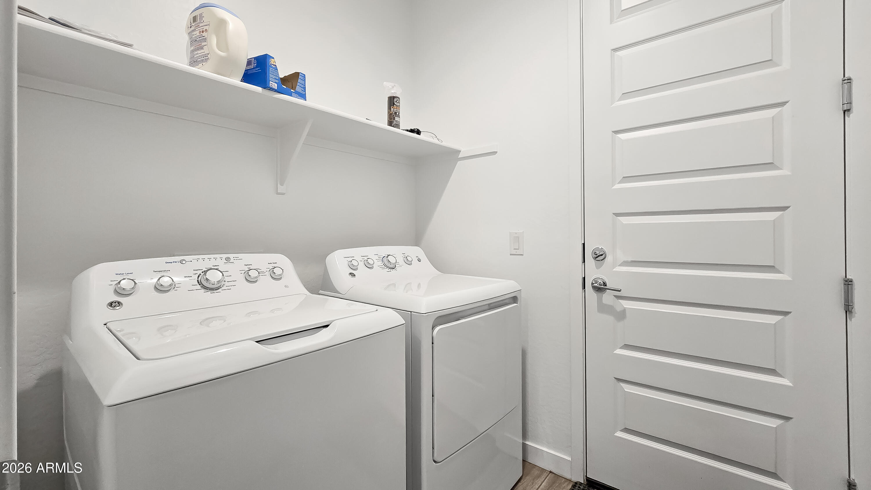 16839 West Evergreen Road Waddell, AZ 85355 - Photo 24 of 28 a utility room with dryer and washer