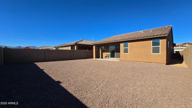 a view of a house with a backyard