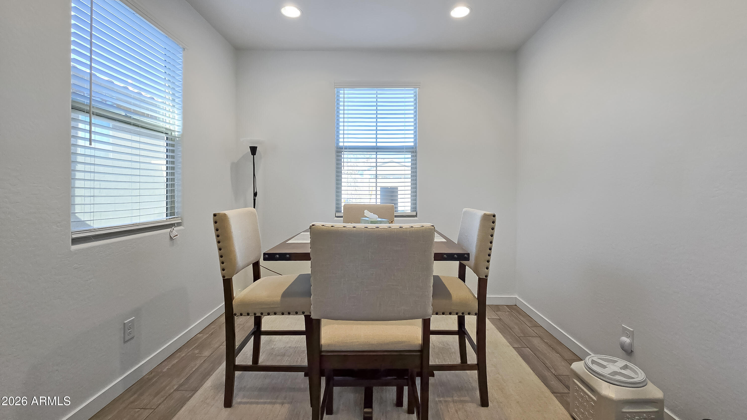 16839 West Evergreen Road Waddell, AZ 85355 - Photo 9 of 28 a dining room with furniture and window