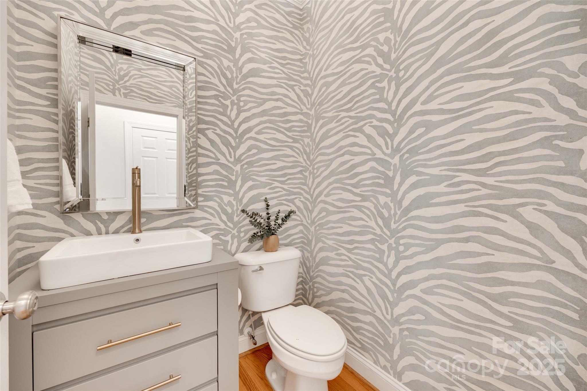 6804 Riesman Lane Charlotte, NC 28210 - Photo 20 of 46 a bathroom with a toilet a sink and mirror