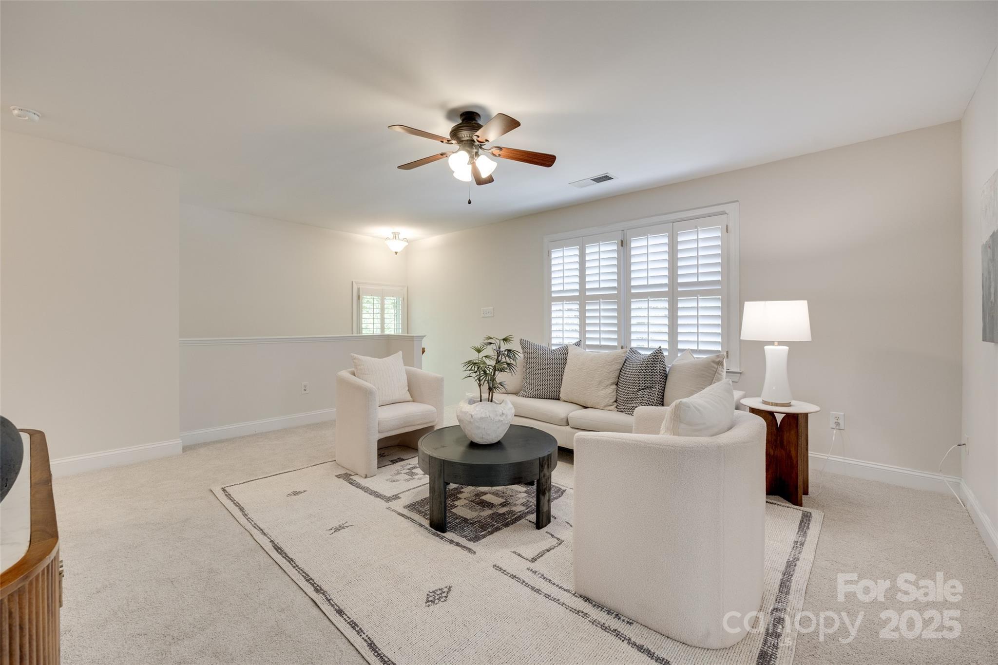 6804 Riesman Lane Charlotte, NC 28210 - Photo 22 of 46 a living room with furniture a chandelier and a window