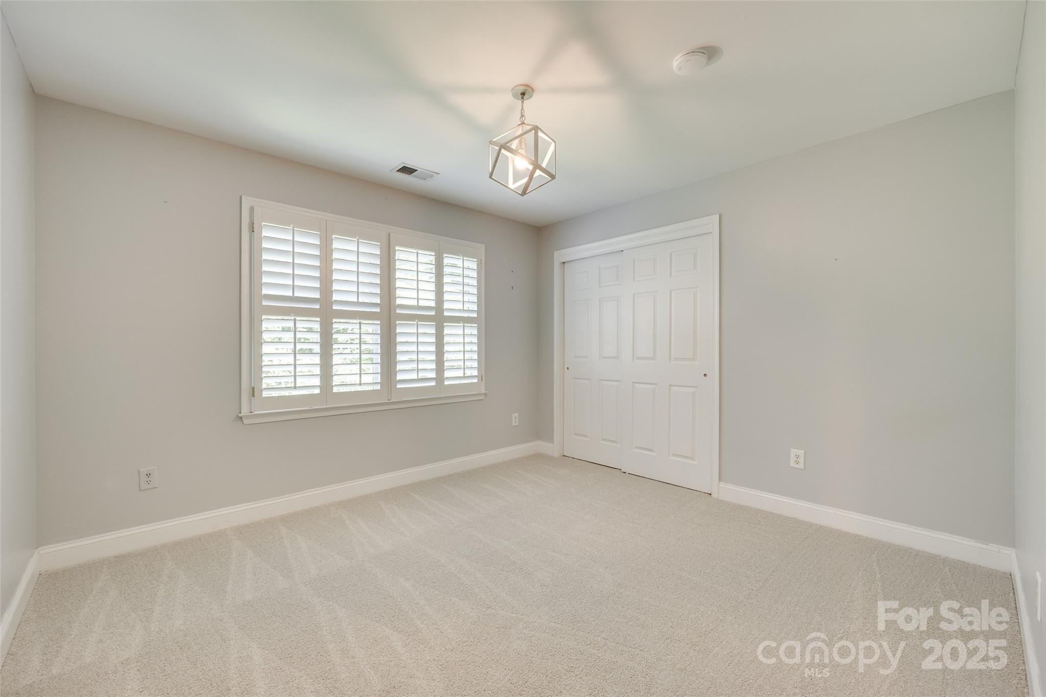 6804 Riesman Lane Charlotte, NC 28210 - Photo 25 of 46 an empty room with windows and cabinet