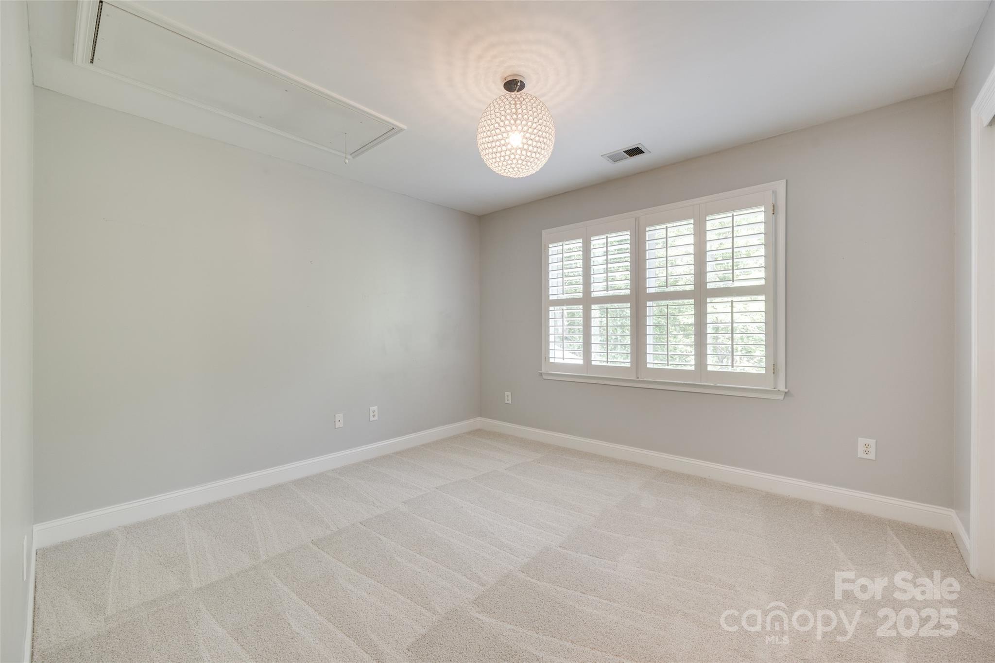 6804 Riesman Lane Charlotte, NC 28210 - Photo 27 of 46 an empty room with windows and yard