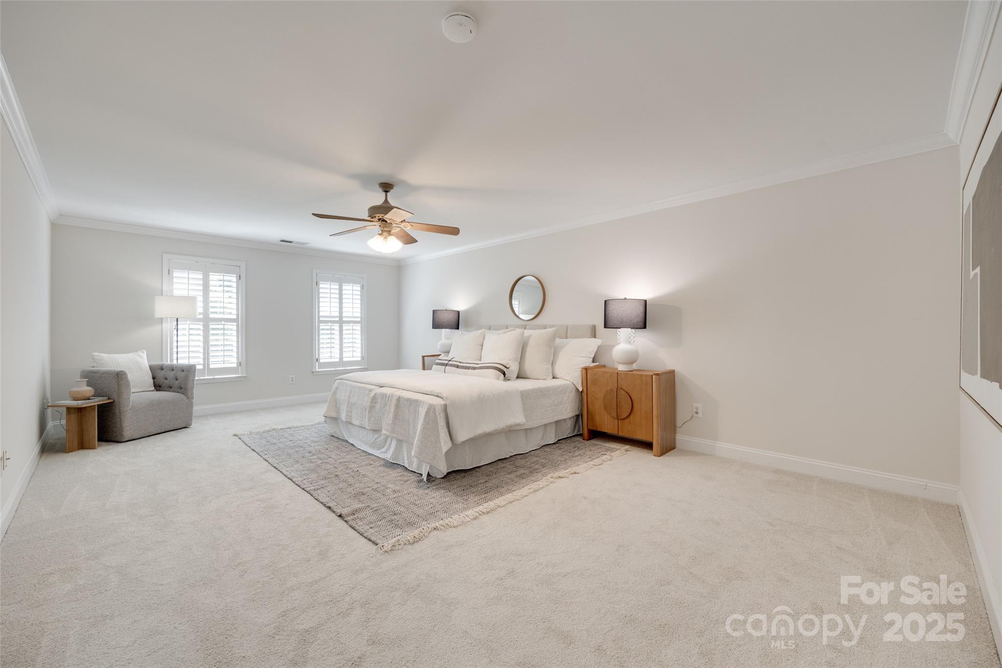 6804 Riesman Lane Charlotte, NC 28210 - Photo 33 of 46 a bedroom with a large bed and a chandelier