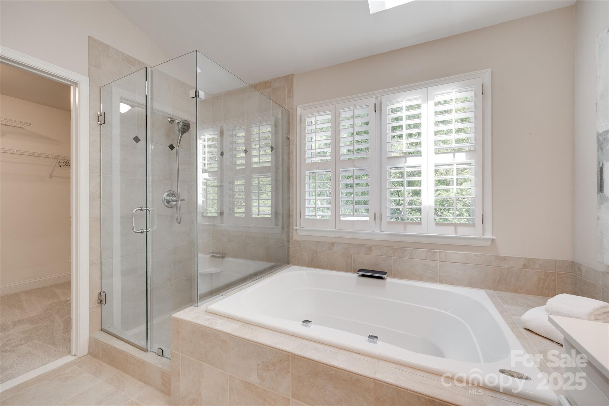 6804 Riesman Lane Charlotte, NC 28210 - Photo 36 of 46 a bathroom with a bathtub and shower