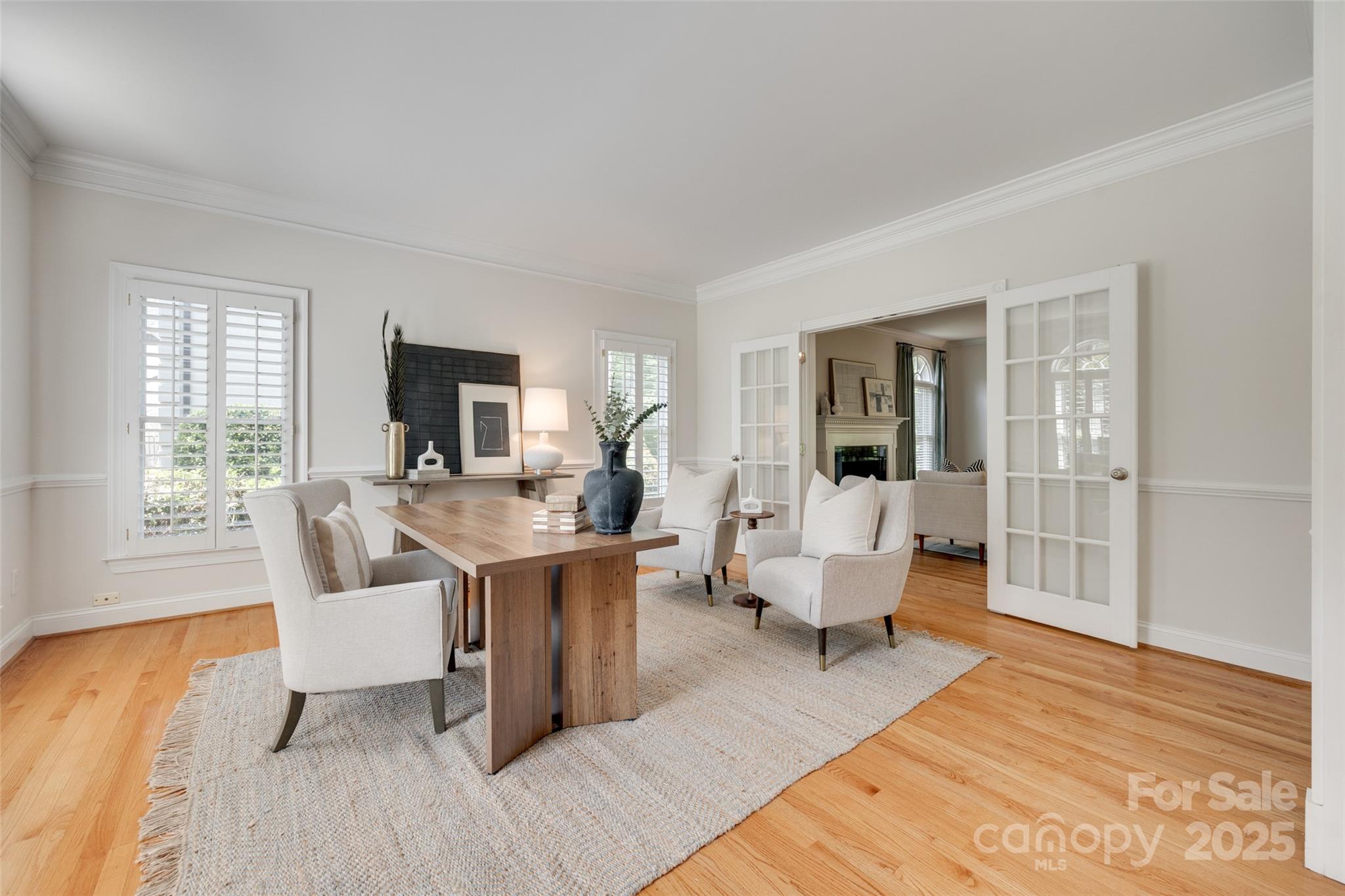 6804 Riesman Lane Charlotte, NC 28210 - Photo 4 of 46 a living room with furniture a large window and wooden floor