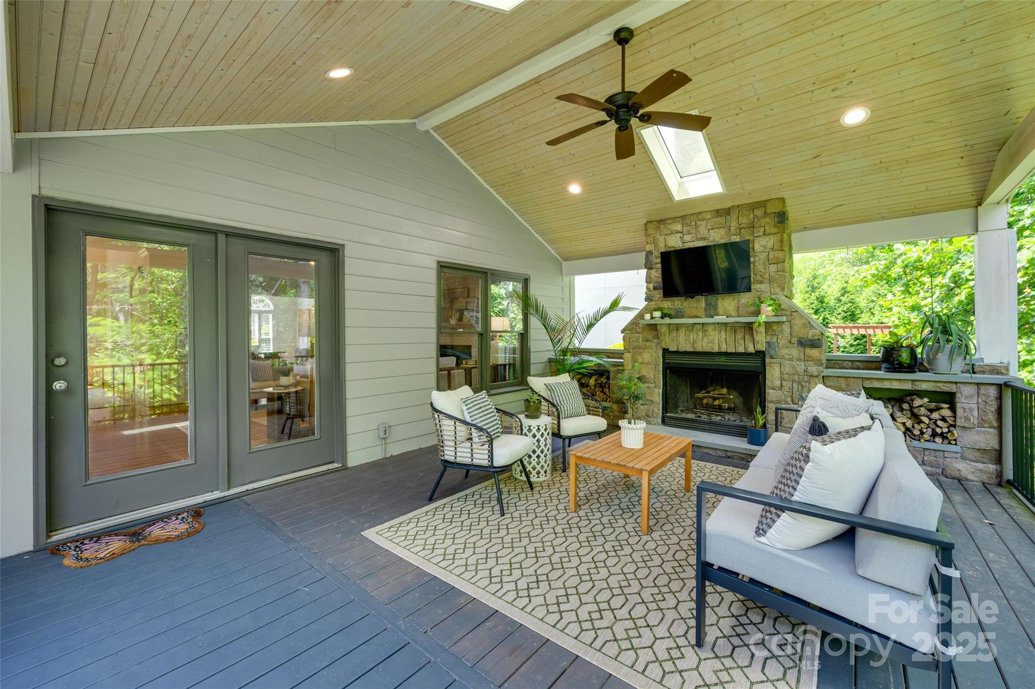 6804 Riesman Lane Charlotte, NC 28210 - Photo 42 of 46 a living room with furniture a fireplace and a flat screen tv