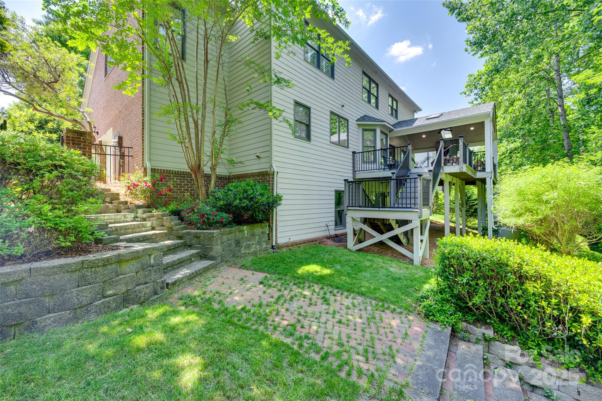 6804 Riesman Lane Charlotte, NC 28210 - Photo 44 of 46 a view of a chair and table in backyard of the house