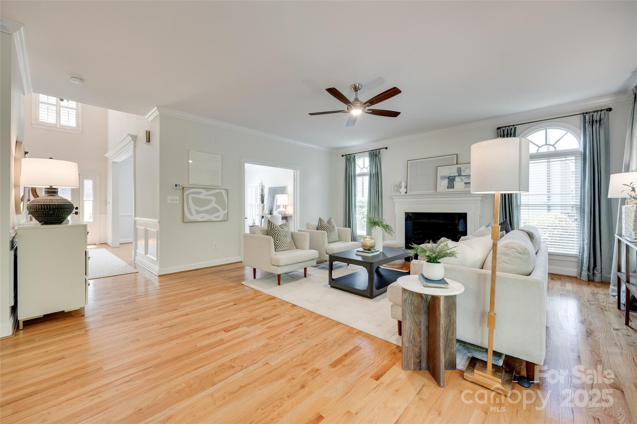 6804 Riesman Lane Charlotte, NC 28210 - Photo 7 of 46 a living room with furniture a fireplace and a view of kitchen