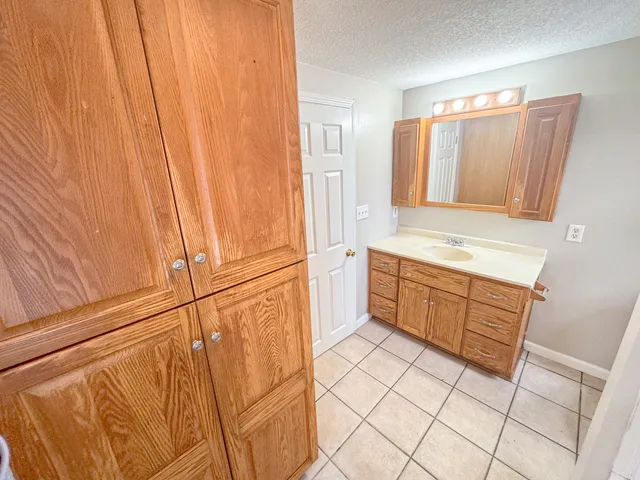 a view of house with backyard and deck