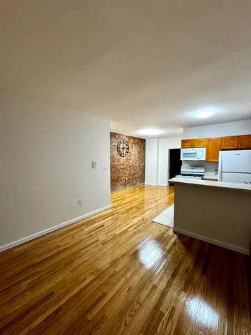 a view of kitchen with wooden floor