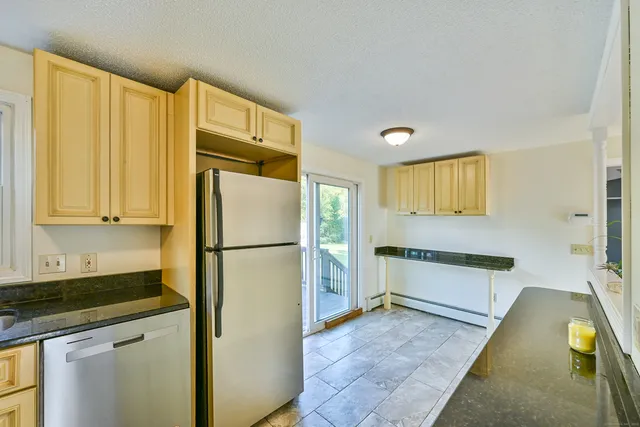 a kitchen with cabinets and stainless steel appliances