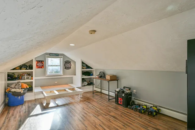 a room with furniture and wooden floor