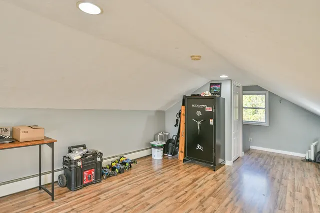 a large kitchen with granite countertop a sink and cabinets