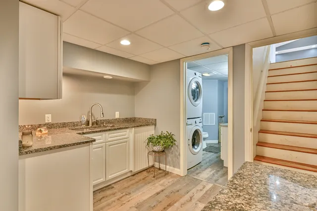 a view of a kitchen and an empty room