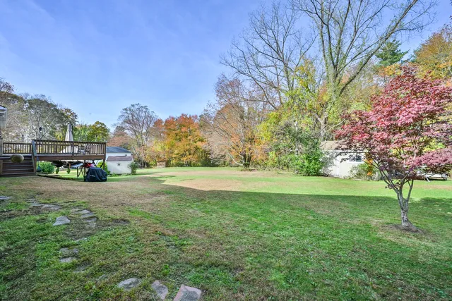 a view of balcony with wooden floor and fence