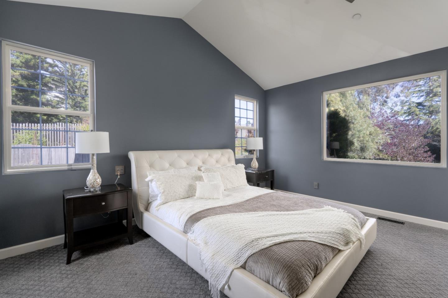 23715 Determine Lane Monterey, CA 93940 - Photo 16 of 43 a bedroom with a bed and a painting on the wall