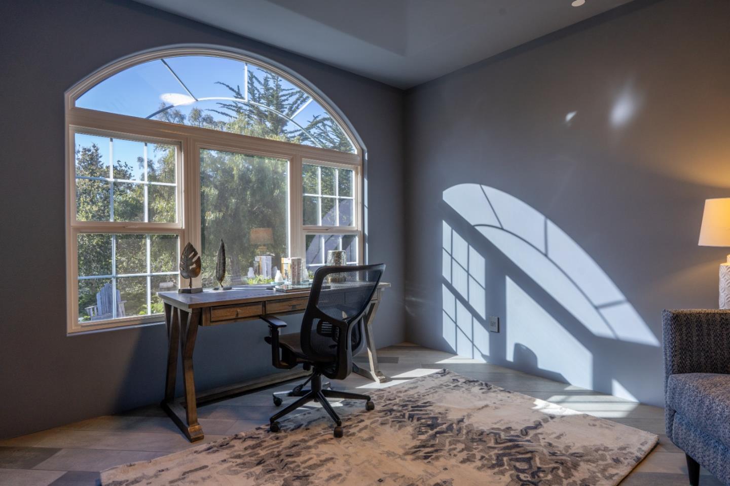 23715 Determine Lane Monterey, CA 93940 - Photo 29 of 43 a view of a workspace with furniture and a window