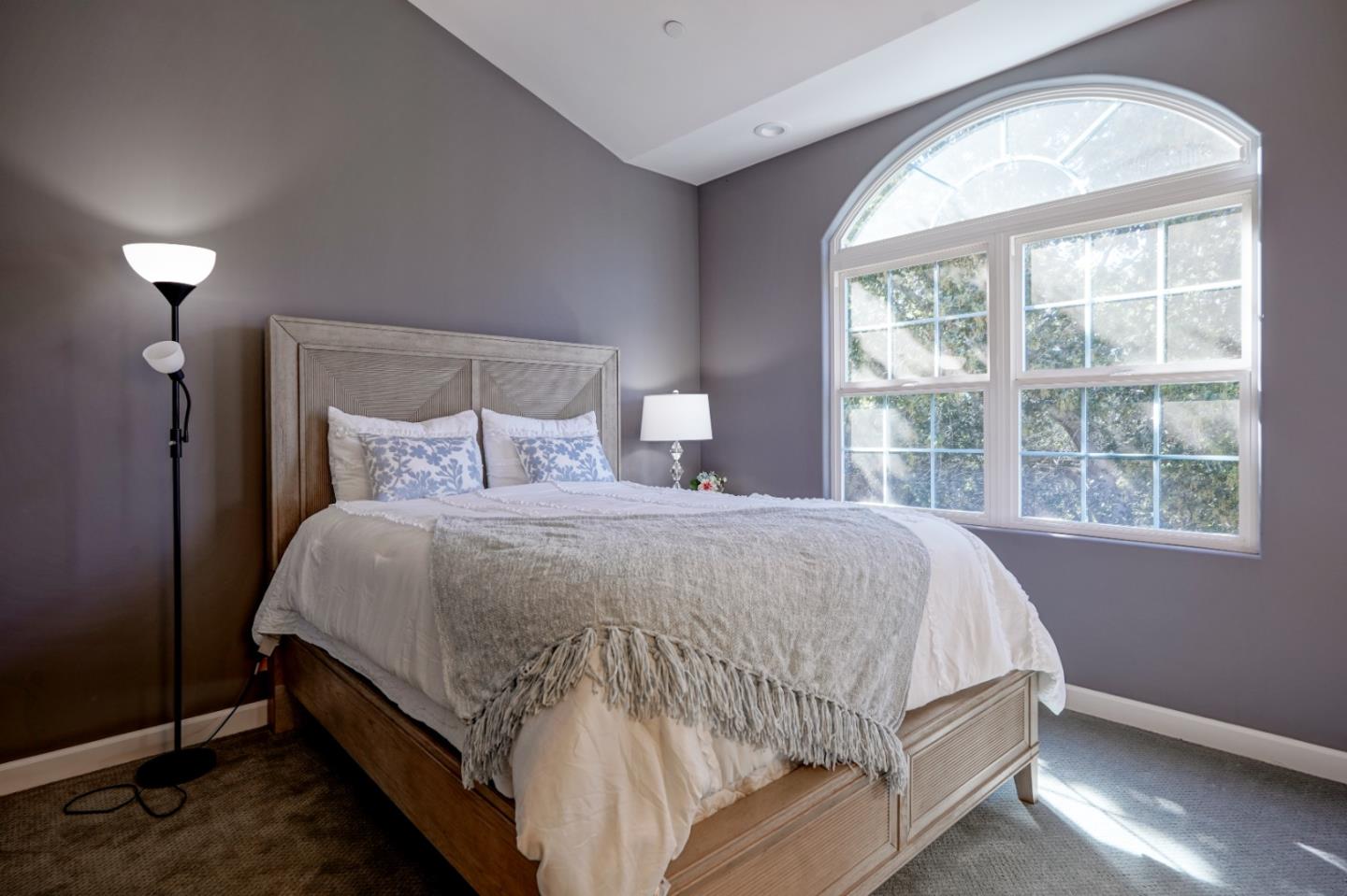 23715 Determine Lane Monterey, CA 93940 - Photo 31 of 43 a bed sitting in a bedroom next to a window