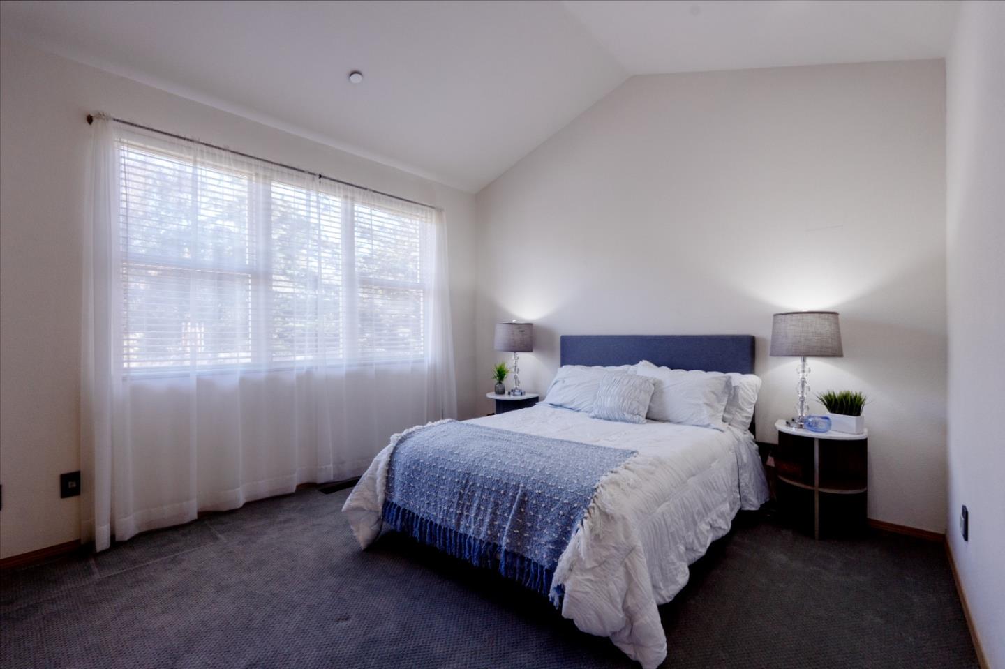 23715 Determine Lane Monterey, CA 93940 - Photo 33 of 43 a bedroom with a bed and a window