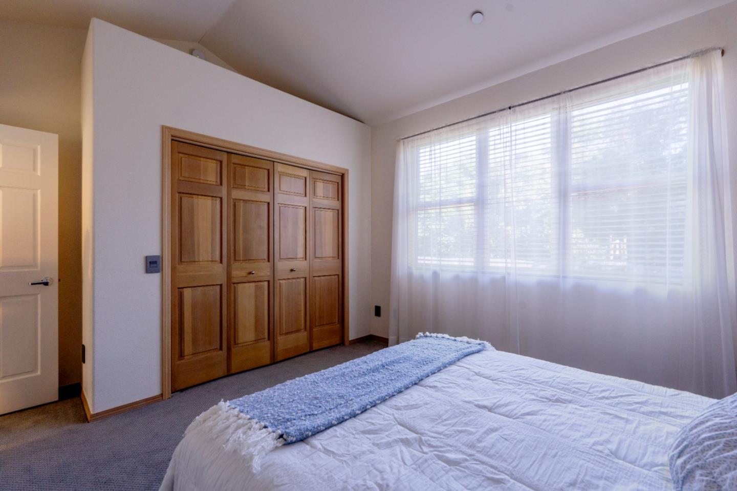 23715 Determine Lane Monterey, CA 93940 - Photo 34 of 43 a bedroom with a bed and a window