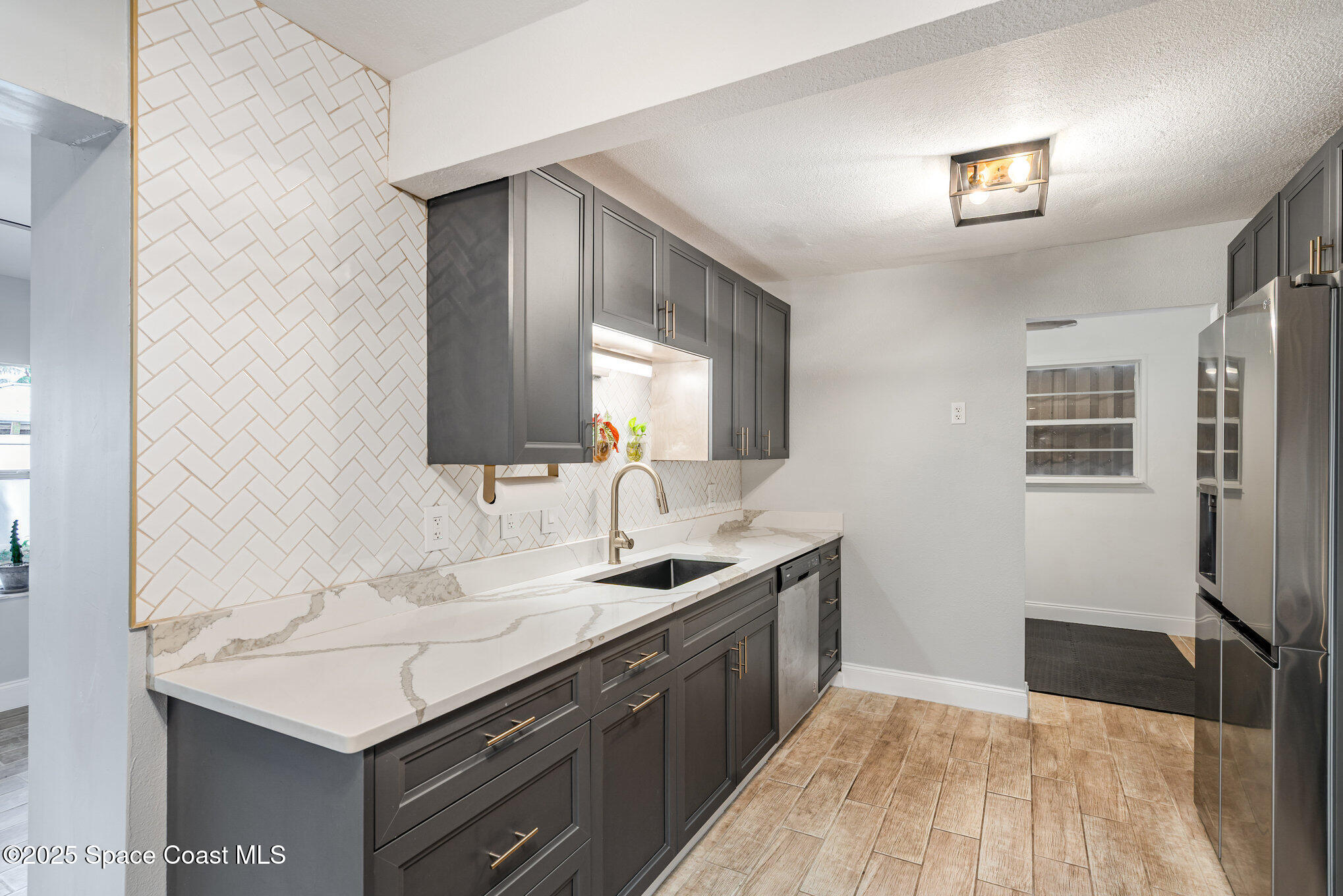 508 Comanche Avenue Melbourne, FL 32935 - Photo 11 of 21 a bathroom with a sink and a mirror
