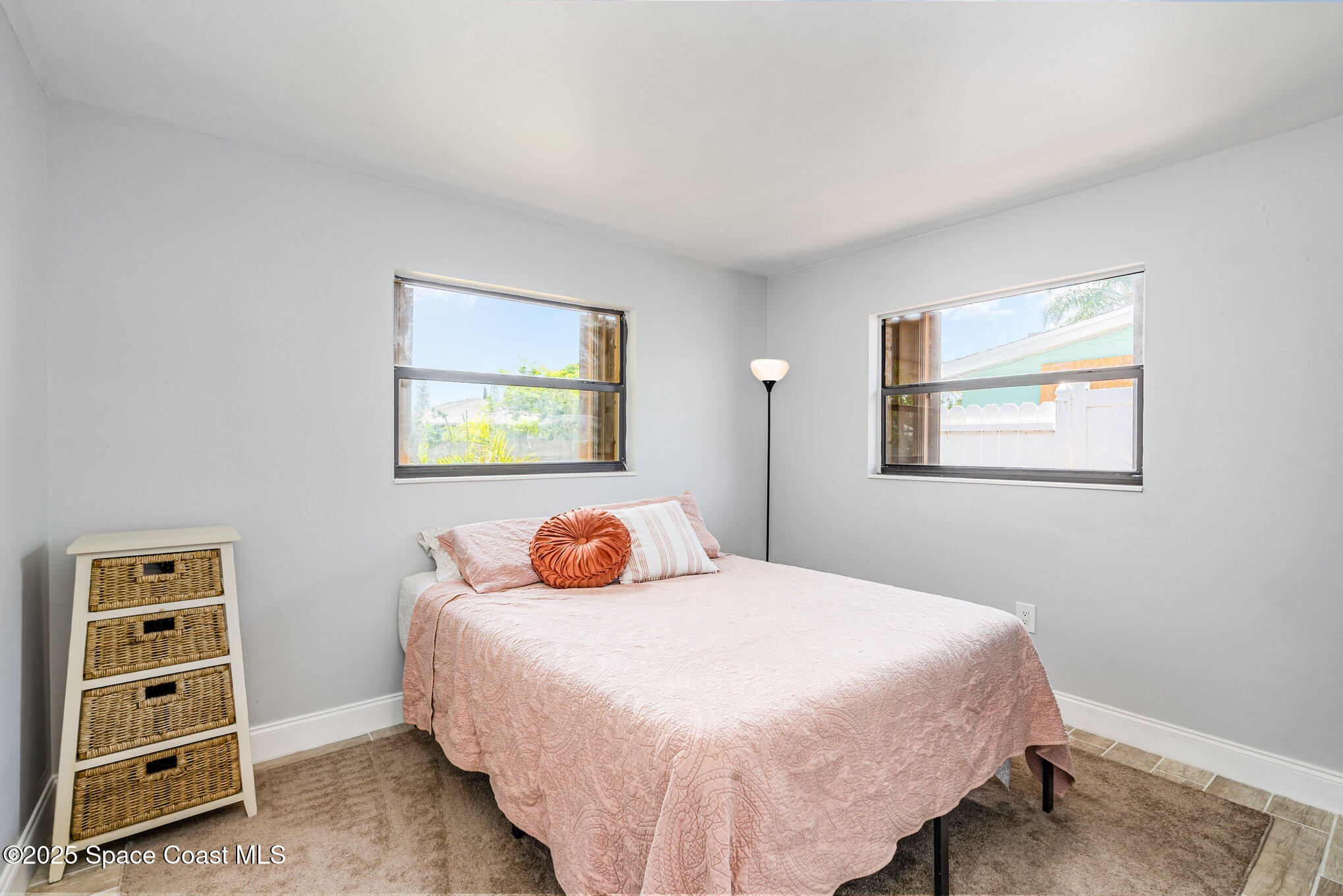 508 Comanche Avenue Melbourne, FL 32935 - Photo 13 of 21 a bedroom with a bed and a window