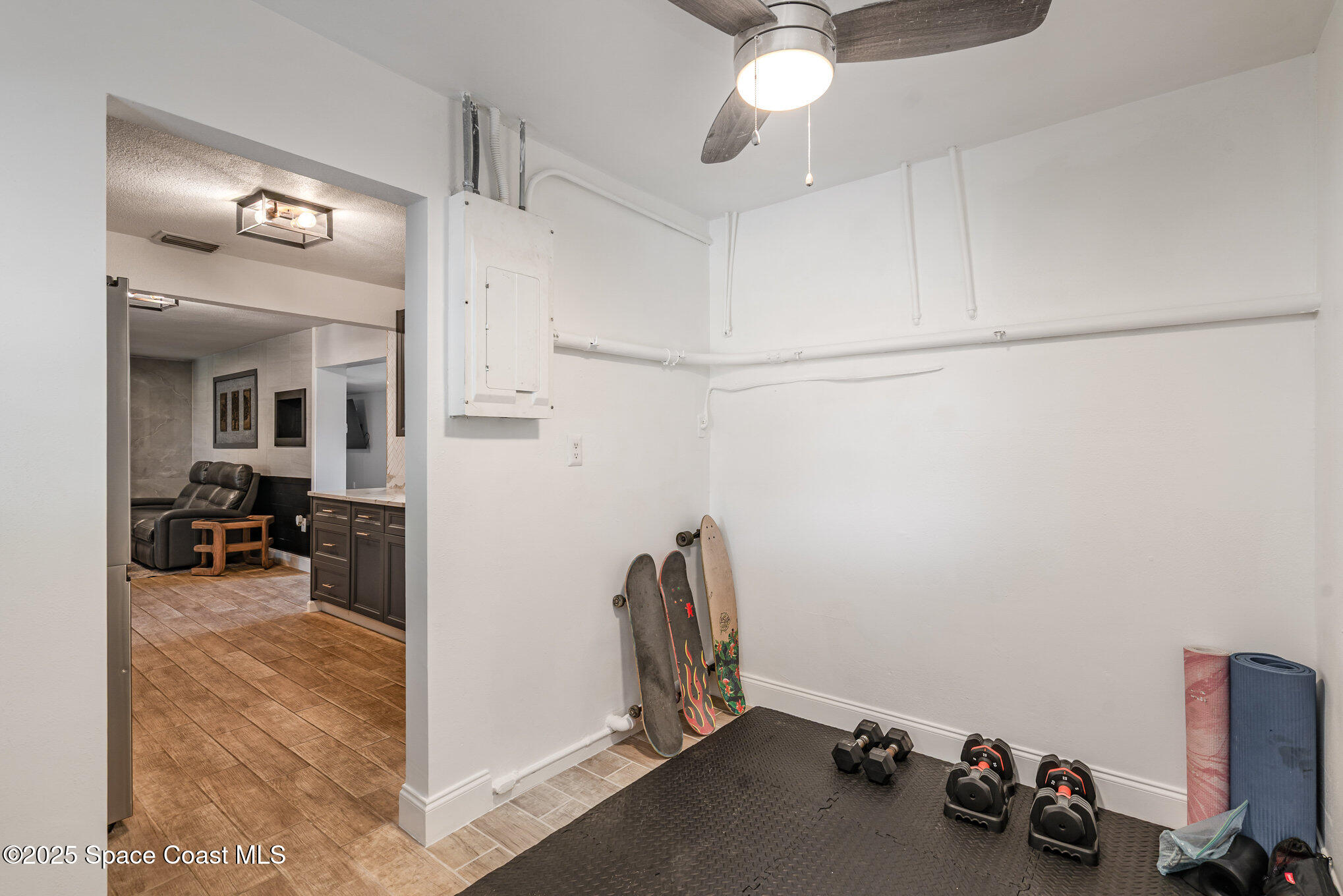 508 Comanche Avenue Melbourne, FL 32935 - Photo 19 of 21 a view of a room with gym equipment